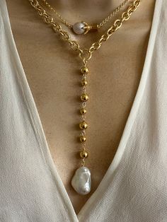 Statement pearl necklaces. Sold separately. 1. pearl Lariat features gold plated stainless steel oval link chain and combination of 8mm and 6mm gold plated stainless Steel beads. Coated large baroque pearl. Pearl size approximately 22mmx15mm. Necklace length around the neck is adjustable 16.5-18.5 inches. Drop 5 inches. 2. Claw charm features gold plated stainless steel claw charm and small baroque pearl. 18k rolo chain. Adjustable length 16-18 inches. 🎁All orders are shipped in a gift box. Baroque Pearl Lariat Necklace With Pearl Charm, Elegant Chunky Chain Lariat Necklace, Elegant Lariat Necklace With Chunky Chain, Lariat Necklace With Baroque Pearl Chain, Gold Dangle Chain Necklace With Pearl Chain, Gold Baroque Pearl Pendant Chain Necklace, Pearl Lariat Necklace As A Gift, Gold Baroque Pearl Pendant Necklace, Gold Chain Necklace With Baroque Pearl Pendant