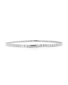 Our half bangle reiterated in 1 carat of diamonds, this bracelet features a uniquely flexible design due to a titanium wire woven within the links. Carat | 1 ctw (+/- .01cts)Clarity | SIColor | DEFCut | Round BrilliantGold | 14 karat Note: In-stock products ship same-day or next-day depending on the time of your order. For made-to-order items please allow up to 1-3 weeks to ship your newest piece of fine jewelry. Adjustable Stackable White Gold Bangle, Modern Stackable Tennis Bracelet, Timeless Platinum Bangle Bracelets, Timeless Platinum Bangle Bracelet, Modern Bangle Bracelet With Box Chain, Modern White Gold Bracelets For Anniversary, Modern Flexible White Gold Diamond Bracelet, Flexible White Gold Bracelet, Elegant White Gold Bracelets With Box Chain