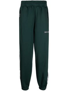 dark green logo print at the leg tapered leg elasticated waistband two side zip-fastening pockets rear welt pocket elasticated ankles Pants Green, Green Logo, Mens Activewear, Tapered Legs, Welt Pocket, Logo Print, Track Pants, Side Zip, Dark Green