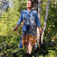 "Whether you love boho style, cottagecore, fairycore, or festival clothing, we've got you covered! An embroidered, faded denim shirt combine unexpectedly and perfectly with lightweight woven fabrics in yellow, blue, and white with lots of playful patterns! What a perfect unique, upcycled dress for autumn temperatures! A swishy, lightweight, swinging asymmetrical hemline makes this a fun dress to wear on its own, or over leggings, tights, or jeans. The possibilities are endless! This dress is perfectly at home in the office, teaching class, or off to a trip to the zoo with the family! Measurements Bust: 32-36\" Sleeve: 21\" Length: 38-42\" Care: Launder with cold water, gentlest cycle. Hang to dry. Or dry clean. More sweater coats like this one, and other upcycled, boho style, cottagecore c Fall Patchwork Denim Dress, Spring Patchwork Medium Wash Denim Dress, Spring Patchwork Denim Dress In Medium Wash, Spring Medium Wash Patchwork Denim Dress, Blue Bohemian Denim Dress For Fall, Bohemian Blue Denim Dress For Fall, Denim Blue Bohemian Long Sleeve Dress, Bohemian Long Sleeve Cotton Denim Dress, Spring Bohemian Long Sleeve Denim Dress