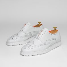 The Priority Leather White Low Top Leather Sneaker With Soft Foam Sole.. Made With Premium Soft Leather Upper. Made With Soft Mesh Lining And Removable Soft Insole For Comfort. Toe Shape Round Pattern Wingtip Closure Lace Up Width Wide Upper Mat Leather Upper Color White Lining Mat Mesh Lining Color Orange Insole Mat Foam Insole Color Orange Welt Mat Rubber Welt Color White Sole Mat Foam Sole Color White White Leather Lace-up Shoes With Textured Sole, White Plain Toe Lace-up Shoes For Derby, White Leather Shoes With Textured Sole And Lace-up, White Lace-up Leather Shoes With Textured Sole, Classic Wingtip Dress Shoes For Summer, Classic Brogue Dress Shoes For Summer, White Lace-up Shoes With Brogue Detailing, Classic Summer Dress Shoes With Brogue Detailing, White Wingtip Lace-up Casual Shoes