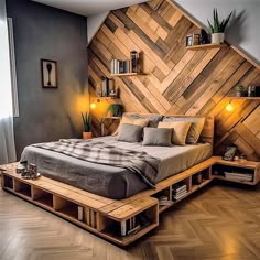 a bed made out of wooden pallets with lights on each side and bookshelves in the middle