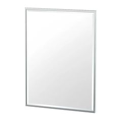 a white bathroom mirror sitting on top of a wall