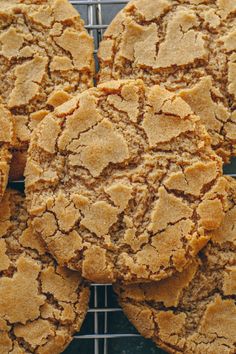 a bunch of cookies that are on a cooling rack