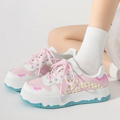 These sneakers feature a playful ice cream-inspired design with pastel colors arranged in a grid pattern, highlighted by whimsical drips and wavy soles for a fun and youthful look. Material: Vegan Leather Run small, please review the sizing information Kawaii Round Toe Sneakers For Streetwear, Pastel Sneakers With Rubber Sole For Streetwear, Pastel Low-top Sneakers With Rubber Sole, Pink Lace-up Skate Shoes With Rubber Waffle Outsoles, Trendy Pink Lace-up Skate Shoes, Trendy Pink Skate Shoes With Laces, Pastel High-top Sneakers With Rubber Sole, Kawaii Low-top Sneakers For Streetwear, Trendy Pink Lace Skate Shoes