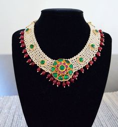 Jeweled Round Necklaces For Festivals, Multicolor Jeweled Bridal Necklace For Wedding, Emerald Gemstone Necklace For Wedding And Festivals, Jeweled Bridal Choker Necklace For Wedding, Wedding Jeweled Bridal Choker Necklace, Traditional Gemstone Choker For Wedding, Red Choker Bridal Necklace For Celebration, Traditional Wedding Choker With Gemstone, Red Bridal Choker Necklace For Celebration