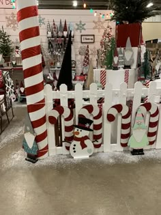 a christmas display in a store filled with lots of holiday decorations and candy canes