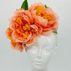 Handmade by Featured Milliner of The Kentucky Derby Museum 2023 & 202 Soft orange peonies with yellow centers and green leaves. Fun, crown-style floral Kentucky Derby Fascinator. Attaches with headband.  Not taking customs this year--Derby 150 is going to be massive and mom life keeps me running! However, happy to suggest pieces that will coordinate with your outfit. If you don't love the way this attaches to your head--message me!  I can swtich *most* pieces to your preference. Clip, Headband O Floral Headpieces For Summer Garden Parties, Summer Flower Headband, Summer Flower Headband For Garden Party, Summer Garden Party Headband With Handmade Flowers, Spring Flower Shaped Headband With Flower Decoration, Flower Shaped Headband For Spring Garden Party, Orange Summer Headband Fascinator, Orange Spring Headband, Orange Headband For Spring