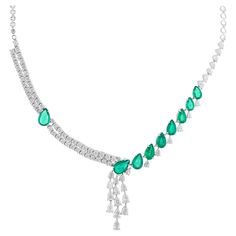 Enhancing the emerald are sparkling diamonds, meticulously set in 18 karat white gold. The diamonds add a touch of brilliance and glamour to the necklace, complementing the radiant green of the emerald. The precise setting of the diamonds showcases the expert craftsmanship and attention to detail, creating a dazzling display of light and sparkle. Item Code :- SEN-5518 Gross Wt. :- 31.75 gm 18k White Gold Wt. :- 28.75 gm Diamond Wt. :- 7.95 Ct. ( AVERAGE DIAMOND CLARITY SI1-SI2 & COLOR H-I ) Necklace Size :- 18 Inches ✦ Sizing ..................... We can adjust most items to fit your sizing preferences. Most items can be made to any size and length. Please leave a note at checkout or contact us via 1stDibs conversation. Even after purchasing the item, you can still ask us to adjust the siz Gemstone Choker Necklace, Gemstone Choker, Necklace Diamond, White Gold Jewelry, Necklace Size, Emerald Gemstone, Natural Emerald, Necklace Sizes, Sparkle Diamonds