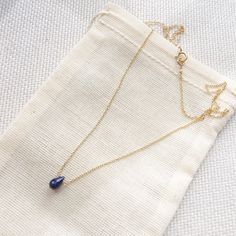 This genuine tiny teardrop sapphire sits on a simple, dainty cable chain. This simple necklace is perfect for everyday wear and is the perfect piece for layering necklaces. Sapphire is the September birthstone. If you need your order by a certain date, it is very important to send us a message on Etsy directly after you place your order, as well as write it in the 'Notes to Seller' at checkout. For more information, please refer to our FAQ page. Jewelry is handmade by us in NYC focusing on quali Delicate Sapphire Jewelry For Gifts, Minimalist Sapphire Jewelry For Gift, Minimalist Sapphire Jewelry As Gift, Minimalist Sapphire Jewelry Gift, Minimalist Sapphire Birthstone Necklace For Gift, Sapphire Teardrop Pendant Necklace Gift, Minimalist Sapphire Necklace For Gifting, Dainty 14k Gold Necklaces With Natural Stones, Everyday Gold Sapphire Jewelry