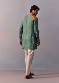 Indulge in elegance with our classic Zayn kurta and pants, featuring a timeless vintage floral design on the shoulder, neck, and cuffs. This piece seamlessly blends tradition with modern style, making it perfect for achieving that contemporary Indian look at any occasion. Traditional Spring Kurta With Set-in Sleeves, Festive Cotton Kurta With Embroidered Cuffs, Fitted Kurta With Set-in Sleeves For Festive Occasions, Traditional Long Sleeve Kurta With Embroidered Cuffs, Traditional Floral Print Bandhgala For Spring, Fitted Cotton Bandhgala With Floral Embroidery, Traditional Spring Bandhgala With Floral Print, Designer Wear Spring Kurta With Set-in Sleeves, Designer Green Kurta For Spring