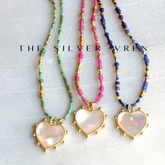 Elevate your jewelry collection with these exquisite handmade beaded necklaces, each adorned with a stunning heart-shaped mother-of-pearl pendant set in a luxurious gold-toned frame. Each necklace is designed to add a touch of elegance and charm to any outfit, making them perfect for both everyday wear and special occasions. Whether you're treating yourself or looking for the perfect gift, these necklaces are sure to impress! D E T A I L S *Tiny seed beads  *Mixed in a random pattern, every neck Heart Shaped Tiny Beads Jewelry Gift, Heart Shaped Beaded Jewelry Gift, Heart-shaped Tiny Beads Jewelry Gift, Gold Beaded Necklaces With Heart Charm And Round Beads, Heart Bead Pendant Necklace As Gift For Her, Gold Necklaces With Heart-shaped Round Beads, Gold Necklaces With Round Heart Beads, Heart-shaped Beads For Valentine's Day Gift, Handmade Beads As Valentine's Day Gift