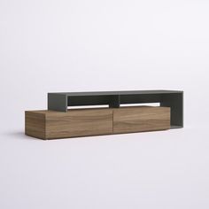 an entertainment center with two drawers on one side and a black shelf on the other