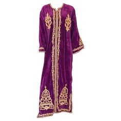 Elegant vintage designer Moroccan kaftan, purple violet color velvet embroidered with Turkish gold threads design all-over. This is an Ottoman style wedding gown with metallic embroidered. The workmanship is incredibly fine. The Bindalli henna dress is a garment made for special occasions such as weddings. Bindallis were worn by the bride, and her female family and friends. Marked by elaborate floral designs bindallis were decorated with dival embroidery, a technique in which metallic threads ar Traditional Purple Kaftan For Festive Occasions, Bohemian Purple Kaftan For Festive Occasions, Purple Bohemian Kaftan For Festive Occasions, Purple Bohemian Festive Kaftan, Purple Embroidered Kaftan For Eid, Long Purple Festive Kaftan, Festive Embroidered Purple Kaftan, Festive Long Purple Kaftan, Bohemian Style Long Purple Thobe