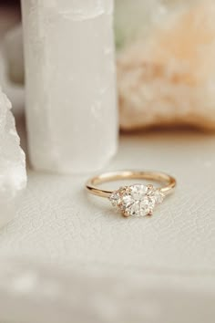 a diamond ring sitting on top of a table