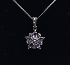 Beautiful vintage sterling silver pendant in a floral form, set with marquise cut amethyst and accented with round cut marcasite stones, on a sterling silver chain necklace.  Pendant - 7/8 x 1/2" - 1.9g - Marked "NF 925" Chain - 19 1/4 inches long - 1.8g - Marked "925" Floral Pendant, Sterling Silver Chain Necklace, Floral Vintage, Marquise Cut, Silver Chain Necklace, Sterling Silver Chain, Last Minute Gifts, Sterling Silber, Vintage Sterling Silver