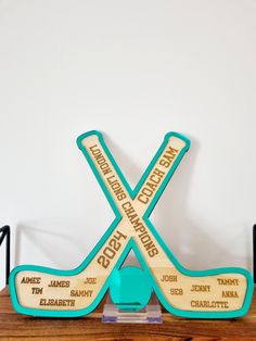 two wooden hockey sticks sitting on top of a table