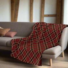 a couch with a plaid blanket on it