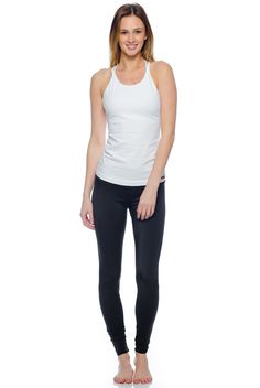 Elevate your basics with the Hard Tail Double Cross Tank. Featuring a White hue, with a high cut neckline, and a double cross design in back, this tank boasts chic style and freedom of movement. Made of a soft, flexible cotton/lycra blend fabric, with a built-in shelf bra, this tank offers comfortable style for in and out of the studio. Wear this tank for yoga, barre, gym sessions, or for everyday style.     Get the Deets:    High cut neckline, for full coverage.  Semi-fitted.  Pre-shr Apparel Branding, Yoga Barre, Yoga Clothing, Long Torso, Cross Design, Cross Designs, Shelf Bra, High Cut, Yoga Clothes