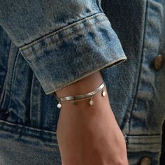 Delicate and versatile, our Serena Dangle Bracelet features a medium-weight chain decorated with dainty geometric circles. This delicate layering bracelet adds elegance to your everyday look and works perfectly in a layered set or worn alone. Sterling Silver Length: 6-7.5in (15-19cm) Lobster clasp Handcrafted in NYC Hypoallergenic, lead and nickel free #B214 Minimal Bracelet, Dangle Bracelet, Geometric Circle, Layered Bracelets, Fashion Accessories Jewelry, Silver Bracelets, Sterling Silver Bracelets, Medium Weight, Everyday Look