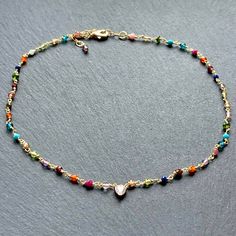 Dainty handcrafted and colorful gemstone beaded choker necklace for women which I have meticulously hand wire wrapped with rainbow colors and added an adjustable extender chain and a small central diamond heart charm in 14k gold plated. This would make cute semi precious stone Christmas gifts for your sister, teens, girls, Mother's Day or birthday jewelry gift ideas for your daughter, daughter in law, granddaughter or girlfriends. This delicate chain choker is entirely handmade by me with multip Bohemian 14k Gold-filled Jewelry With Colorful Beads, Multicolor Tiny Beads 14k Gold Filled Jewelry, 14k Gold Filled Multicolor Tiny Beads Jewelry, Multicolor Round Beads 14k Gold Filled Jewelry, 14k Gold Filled Multicolor Round Beads Jewelry, Multicolor 14k Gold Filled Round Bead Jewelry, Handmade Multicolor 14k Gold Filled Jewelry, Multicolor 14k Gold-filled Round Beaded Jewelry, Colorful Beads 14k Gold-filled Jewelry Gift