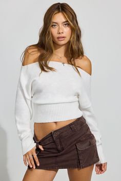 This fit is giving late '90s sitcom chic. Features - Off-the-shoulder construction - Rib knit Size & Fit - Fit: Fitted - Length: Cropped - Model is wearing size S Materials & Care - Content: 50% recycled polyester, 46% polyester, 4% spandex - Care: Machine wash, cold - Imported