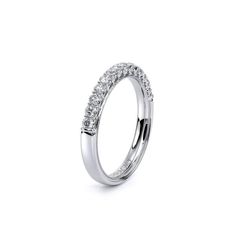 a wedding ring with three rows of diamonds on the side, set in 18k white gold