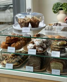 a display case filled with lots of different types of pastries