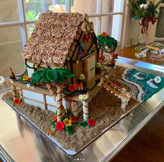 a gingerbread house made to look like it's on top of a table