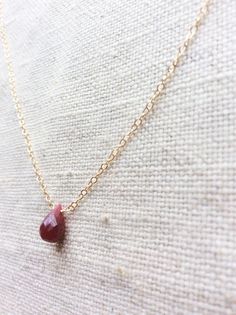 This is a ruby necklace made of genuine high quality faceted ruby and gold filled chain. This gold ruby necklace is July birthstone. Rudy is Red Ruby Gemstone Necklaces, Red Ruby Gemstone Necklace, Red Ruby Birthstone Necklaces, Red Ruby Gemstone Birthstone Necklace, Dainty Ruby Gemstone Necklace, Ruby Birthstone Necklaces, Ruby Briolette Gemstone Jewelry, Red Ruby Birthstone Necklace, Yellow Gold Ruby Teardrop Necklace