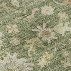 an old rug with flowers and leaves on it