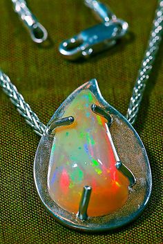 ♡ DETAILS: Beautiful color display in our one-of-a-kind statement or layering necklace, which is a hand carved teardrop free form, Precious Crystal White Opal! We hand carved & polished this 6.39 carat AAA grade precious gem. This is a natural, un-treated opal. A very meaningful jewelry gift for anyone born in October, as Opal is the October birthstone. Also the perfect gift for a Libra.  Since this is a special stone, it deserved a special setting, so we hand-made a bold free form pendant using One Of A Kind Pendant Fine Jewelry, One Of A Kind Fine Jewelry Pendant, Fusion Style Pendant Jewelry For Formal Occasions, Elegant Teardrop One-of-a-kind Jewelry, Elegant One Of A Kind Teardrop Jewelry, Formal Fusion Pendant Jewelry, Unique Teardrop Pendant Necklace With Polished Finish, Polished Drop Jewelry For Wedding, Polished Finish Drop Jewelry For Wedding