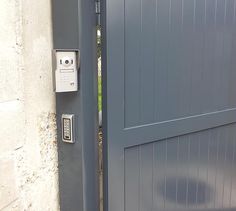 an open door to a house with a remote control on the front and side doors