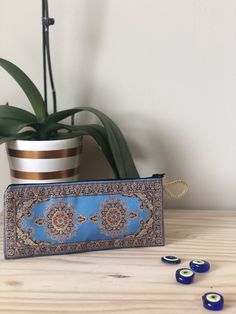 "--COLOR PERSONALIZATION. Choose your favorite color from the list of available options that matches your personality. --Beautiful woman's coin purse with authentic Turkish/Oriental carpet design --Top of each coin purse is tapestry-style woven rug design out of polyester --Black inside lining in each coin purse - with small pocket - one zipper outside --Can be used as card wallet, and small make-up bag --EASY TO CLEAN: The lined keepsake case is machine washable and built to last with a strong Handmade Blue Pouch Wallets, Blue Rectangular Coin Purse With Removable Pouch, Handmade Blue Coin Purse For Travel, Portable Pouch Pencil Case As Gift, Blue Embroidered Rectangular Pouch, Handmade Blue Rectangular Pouch, Handmade Blue Rectangular Coin Purse, Rectangular Blue Coin Purse, Blue Pencil Case With Removable Pouch As A Gift