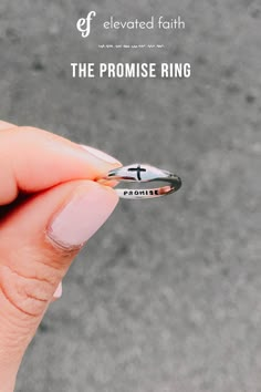 a person holding a ring with the word, the promise ring written on it's side