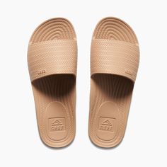 Women's Water Scout Slide in Oasis | REEF® Beige Round Toe Sport Sandals For Beach, Beige Open Toe Sport Sandals For Beach, Casual Beige Sport Sandals For The Beach, Poolside Slip-on Sandals With Textured Footbed, Beach Slippers With Textured Sole, Comfortable Beach Slippers With Textured Sole, Comfortable Slippers With Textured Sole For Beach, Beige Sport Sandals With Cushioned Footbed For Beach, Beige Cushioned Sport Sandals For Beach