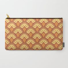 an orange and yellow pattern with fan shapes on it carry - all pouch, featuring gold zipper