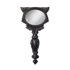 an ornate black mirror on a white background