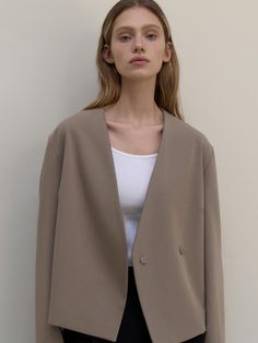 This is a clean and casual jacket by L’oiE that is made out of high quality and sturdy fabric. With unique design detail and trendy mood, you can style it for your refined and casual daily outfit.- Relaxed loose silhouette- Deep pin tuck detail on the back- Double snap closure Minimalist Long Sleeve Fall Outerwear, Chic Office Wear Outerwear, Oversized Khaki Blazer For Workwear, Khaki Blazer For Business Casual In Spring, Trendy Beige Blazer With Lapel Collar, Khaki Blazer For Spring Business Casual, Business Casual Khaki Blazer For Spring, Chic Everyday Single Breasted Blazer, Minimalist Long Sleeve Outerwear For Work