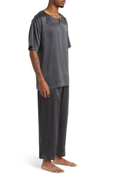 A henley-style top pairs with matching bottoms in breathable silk pajamas that feel like a dream and can be cleaned in the washing machine. Top has crewneck; short sleeves Bottoms have elastic waist; front slant pockets 100% silk Machine wash, dry flat Imported Relaxed Fit Casual Pant Set For Daywear, Casual Relaxed Fit Pant Set For Daywear, Silk Sleepwear For Loungewear In Relaxed Fit, Silk Sleepwear Relaxed Fit For Loungewear, Casual Viscose Sleepwear For Loungewear, Casual Silk Sleepwear For Pajama Party, Relaxed Fit Viscose Sleepwear For Loungewear, Silk Casual Sleepwear For Pajama Party, Relaxed Fit Short Sleeve Pant Set For Loungewear