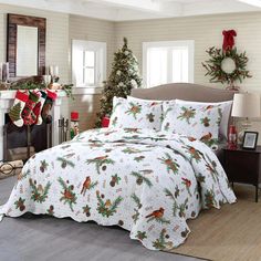 a christmas themed bed spread in a bedroom