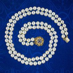 A classy vintage pearl matinee necklace from the late 20th Century displaying two strands of luxurious, creamy-white cultured pearls that are exceptionally bright with a smooth glossy surface.     Pearls are the birthstone of June and a true treasure of the ocean, produced organically by fresh and saltwater molluscs. Their spherical shape and exceptional lustre have long been associated with the beauty of the moon and are symbolic of purity, serenity, and loyalty.   The strands are held securely Formal Vintage Akoya Pearl Necklace, Vintage Akoya Pearl Necklace For Formal Occasions, Vintage Akoya Pearl Necklace For Anniversary, Pearl Necklace For Anniversary, Classic Double Strand Pearl White Necklace, Formal Double Strand Pearl Necklace With Pendant, Double Strand Pearl Necklace For Formal Occasions, Formal Double Strand Pearl Necklace, Classic Pearl Necklace With Jewels For Anniversary