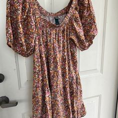 Super Pretty Floral. Very Retro Look But Brand New! Short ‘Balloon’ Sleeves. Oversized. Elastic Running All Across Neckline So Can Wear This Off The Shoulder Too! So Lightweight And Breezy It’ll Take You From Spring Into Summer And The Colors Can Take You Into Early Fall!! Really Get Your $’S Worth!! It’s Tiered In Subtle Ruffle Look But Hard To See In Pix Because Of The Pattern. Just Lovely And Girlie In Person! Comes Several Inches Above Knee. Medium Will Def Fit Also. Cute With Sandals Or Whi Hippie Dress For Spring Brunch, Casual Floral Print Boho Dress For Festivals, Casual Boho Dress With Floral Print For Festival, Spring Hippie Mini Dress With Boho Print, Spring Boho Sundress Mini Dress, Multicolor Casual Boho Dress With Short Sleeves, Casual Multicolor Boho Dress With Short Sleeves, Casual Multicolor Short Sleeve Boho Dress, Bohemian Sundress With Ditsy Floral Print For Vacation