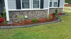 a house with landscaping in the front yard