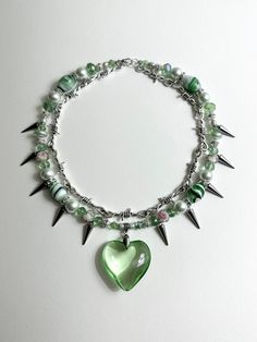 Spiked Pistachio Necklace 17 in. Made with stainless steel wire, glass beads, metal beads, freshwater pearls, vintage beads, glass heart charm. Necklaces Diy Ideas, Charm Necklace Ideas, Beaded Necklace Ideas, Bead Jewelry Ideas, Y2k Beaded Necklace, Beads Clothes, Diy Collier, Bijoux Fil Aluminium, High Fashion Jewelry