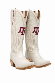 Women's Collegiate Gameday Boots in Ivory Details Available in sizes 5 - 13 INCLUDING 1/2 SIZES Premium Geniune Ivory Leather Goodyear Welt Construction Memory Foam Insole Smooth Leather Lining Natural Stacked Wood Heel Western Embroidery Stitching Embroidered Team Logos Snip-toe Pull on Style with V Front and Back 14" Shaft Height and Circumference CLC Approved Sizing Sizes 5 - 13 to include 1/2 sizes! Fit Boots run 1/2 size small. Size up 1/2 size. Gameday Fits, Western Embroidery, Handcrafted Boots, Embroidery Stitching, Bow Headband Hairstyles, Western Boots Women, Wood Heel, Ole Miss, Western Boot