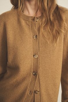 Our 100% cashmere Greta long-sleeve cardigan is the staple piece you need. Perfect for Layering your look and add a touch of something special. Wear it closed up to the top to play it preppy, or open for a more relaxed fit. Unisex and versatile as always, it allows you to express yourself and interpret it as you want, giving you the touch of elegance you need in every fit. Charlotte’s fashion tip: "I love how this piece follows my moods everyday ! When I’m playing the elegance card, I like to wear it on its own, closed, paired with a scarf. When I’m in the mood for a more casual outfit yet with the bit of sophistication I always like, but with the touch of sophistication I always crave for, I leave it open with a nice cashmere and silk top." A true staple piece! Everyday Wool Sweater For Fall, Brown Cashmere Cardigan With Buttons, Merino Wool Outerwear With Button Closure For Layering, Classic Everyday Fall Sweater Coat, Classic Everyday Sweater Coat For Fall, Cozy Fine Knit Outerwear For Layering, Classic Wool Cardigan For Everyday, Everyday Cashmere Sweater With Ribbed Cuffs, Wool Sweater For Everyday