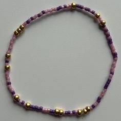 - made with various colors randomly mixed 3mm 14k gold - filled beads and 2mm seed beads - hand beaded bracelet made with elastic sting for a slight stretch to roll easily on and off your wrist  - measured standard (6.25") or extended (6.75") - stacks well with all bracelets Dainty Purple Beaded Bracelet, Dainty Purple Beaded Bracelets With Round Beads, Dainty Purple Beaded Bracelet With Round Beads, Lavender Beaded Bracelet With Tiny Beads For Gifts, Lavender Beaded Bracelets With Tiny Round Beads, Adjustable Purple Beaded Necklace With Tiny Beads, Adjustable Lavender Beaded Bracelets With Tiny Beads, Purple Beaded Heishi Beads Bracelets, Lavender Beaded Bracelets With Spacer Beads