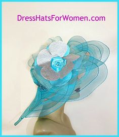 Women's Turquoise Blue And Metallic Silver Wide Sheer Scalloped Brim Dress Custom Fashion Hat For Special Occasion. This Gorgeous Designer Hat Is Trimmed With A Large Turquoise Blue Horsehair Crinoline Bow, Enhanced With A Handmade Turquoise Blue And Metallic Silver Flower. A Large Turquoise Blue Satin Rosette Is Placed In The Center Of This Gorgeous Flower. A Beautiful Embroidered Sequin Turquoise Blue And Metallic Silver Trim Encircles The Crown Of This Fashion Kentucky Derby Hat. Crown Measur Bride Apparel, Mother Of The Bride Fashion, Special Occasion Hats, Mother Of The Bride Hats, Church Lady Hats, Elegant Hat, Custom Made Hats, Horse Races, Occasion Hats