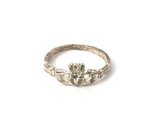 Claddagh Irish Heart Crown Sterling Silver Ring Sz 4 Estate Jewelry Pre-Owned Type: Ring Size: 4 Width: 6 mm Weight: 1.2 gr Hallmark: .925 LL Condition: Well loved ring with scattered scratch and patina. It would be easy to polish up Comments: This ring can be re-sized, it's very petite now and lightweight Please see all photos for details Irish Heart, West Sacramento, Heart Crown, Claddagh Ring, Claddagh Rings, Irish Jewelry, Pretty Jewellery, Estate Jewelry, Rings Statement